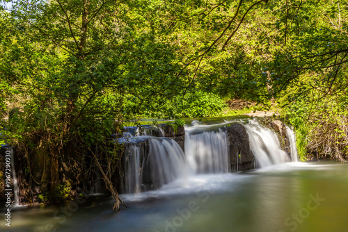 Monte Gelato waterfall surrounded by lush greenery and tranquility in Mazzano Romano, Lazio.