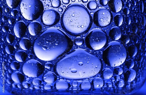 Blue oil bubbles in water abstract macro background texture high resolution photo