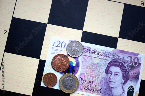 British pounds close-up on a chessboard background. National currency of Great Britain
