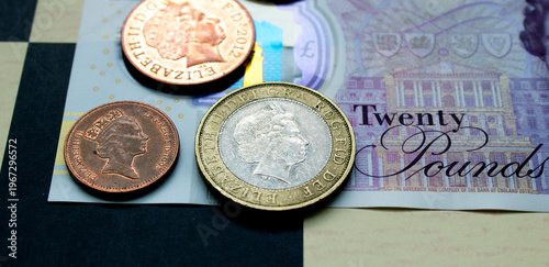 British pounds close-up on a chessboard background. National currency of Great Britain