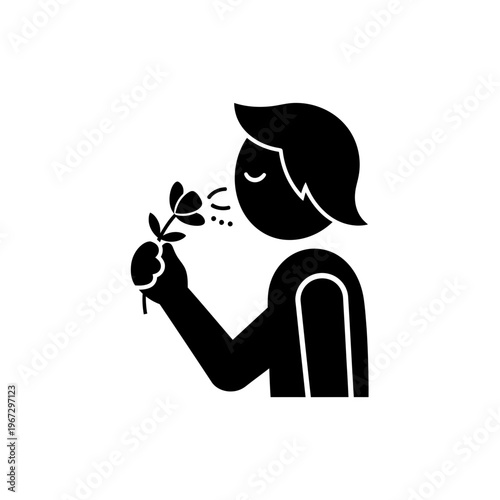 Person smelling a flower enjoying the pleasant aroma and fragrance of nature.