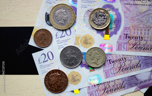 British pounds close-up on a chessboard background. National currency of Great Britain