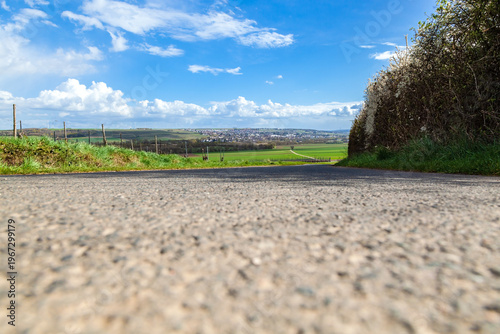 Empty Asphalt Road with Plenty of Copy Space Leading to Village