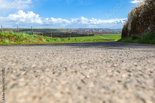 Empty Asphalt Road with Plenty of Copy Space Leading to Village