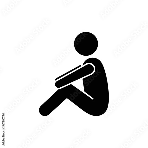 Silhouette of a person sitting with knees drawn up in a moment of contemplation.