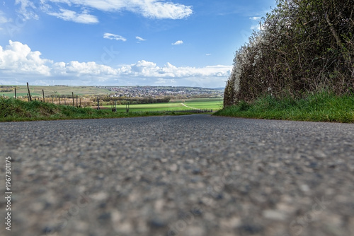 Empty Asphalt Road with Plenty of Copy Space Leading to Village