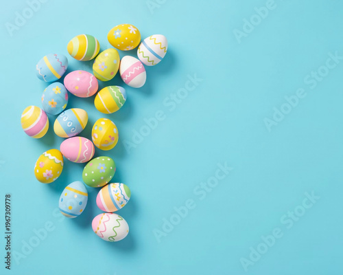 A collection of vibrantly decorated Easter eggs are arranged in the upper left corner of the image, curving towards the center