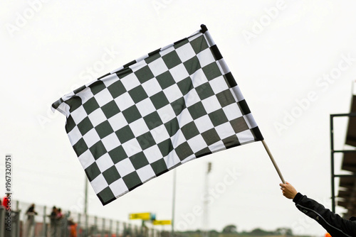 checkered flag on a blue sky background