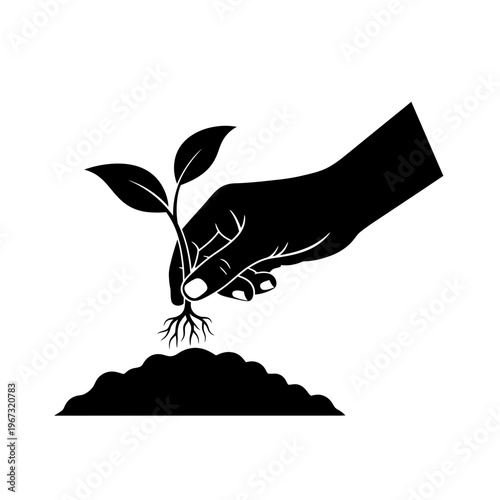 Hand planting a seedling in soil symbolizing growth and new beginnings in nature.