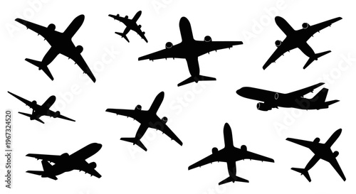 Collection of various airplane silhouettes in different flight positions.