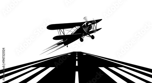 Biplane taking off from runway in a striking black and white silhouette.