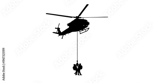 Silhouette of a helicopter performing a rescue operation with two people being hoisted up.