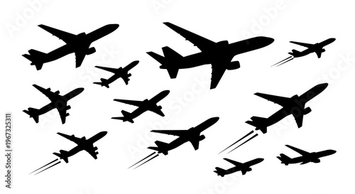 Silhouettes of various airplanes flying in different directions.