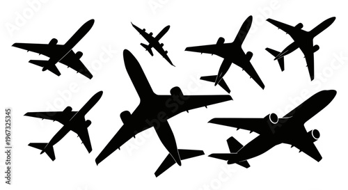 Silhouettes of various airplanes flying in different directions.