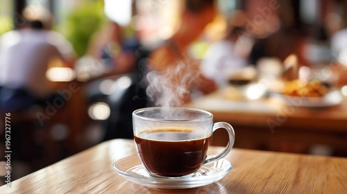 Hot Coffee Cup Sits on Wooden Table in Busy Cafe During Morning Hours