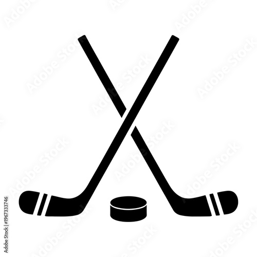 Vector of two crossed hockey sticks and a puck