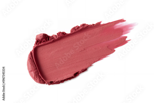 Smear of reddish pink lipstick on white background