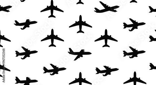 Seamless pattern of black airplane silhouettes flying in different directions on a white background for travel and aviation design concepts.