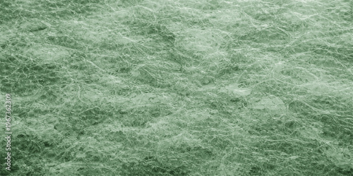 A clean macro wallpaper design featuring a wet green grass texture with turquoise water drops on a liquid surface pattern for a textured nature backdrop