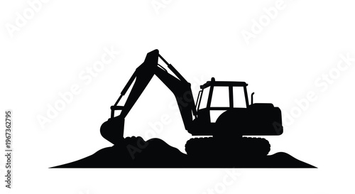 Black excavator digging earth a striking monochromatic silhouette