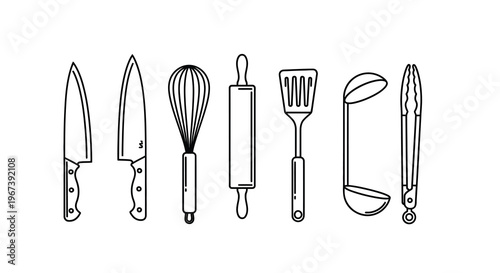 A collection of various black and white kitchen utensils displayed in a row