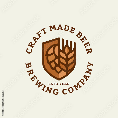A stylish logo representing a brewing company, featuring a shield, hops, and wheat, emphasizing quality in craft beers with a touch of tradition and reliability.
