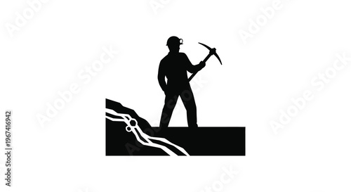 Miner with pickaxe standing on rock a striking black silhouette