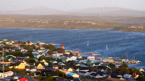 Photos Aerial view of Stanley harbor and colorful townscape with calm bay and soft natural light, Falkland Islands