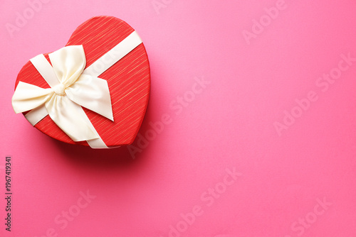 Beautiful heart shaped box on pink background, top view. Space for text