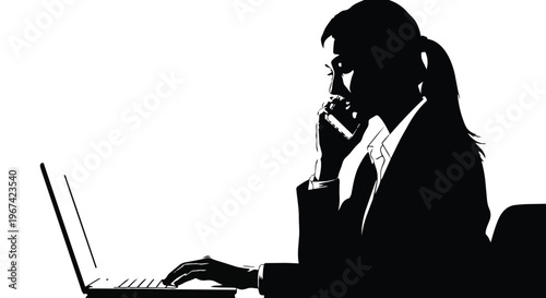 Silhouette of a businesswoman working on a laptop while talking on the phone