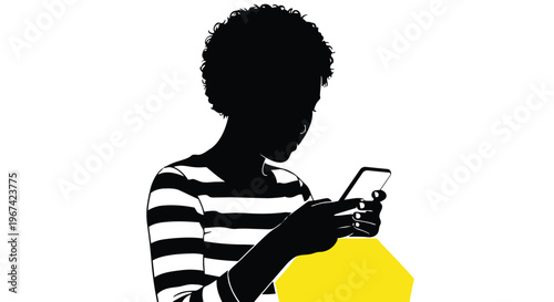 Silhouette of a young woman with curly hair looking at her smartphone