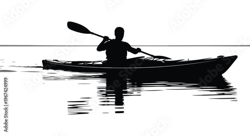 Kayaker paddling on calm water a striking black silhouette
