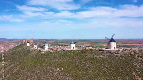 Aerial Pullback from Consuegra Windmills Revealing Historic Town – Don Quixote Landscape, Toledo Spain