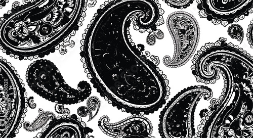 Elegant black and white paisley pattern creates a decorative and traditional background design suitable for textiles or digital applications.