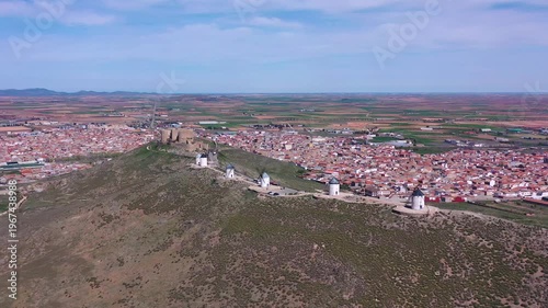 Aerial View of Consuegra Windmills with Historic Town in Background – Iconic Travel Destination in Castilla La Mancha, Spain
