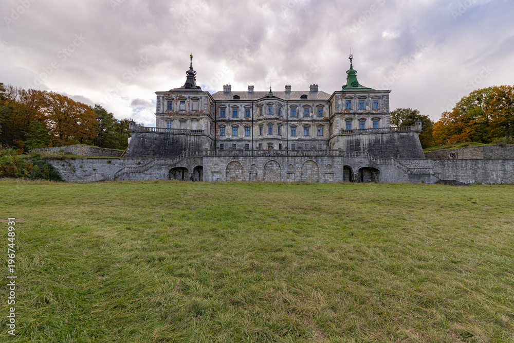 Fototapeta premium Renaissance Pidhirtsi Castle with dramatic storm clouds in Ukraine