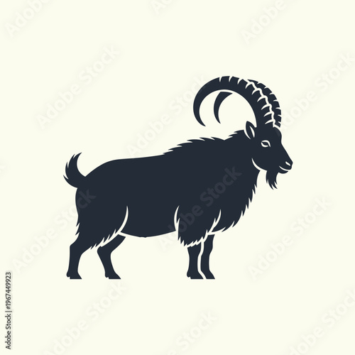 Silhouette of a majestic mountain goat with impressive curved horns standing proudly 1.