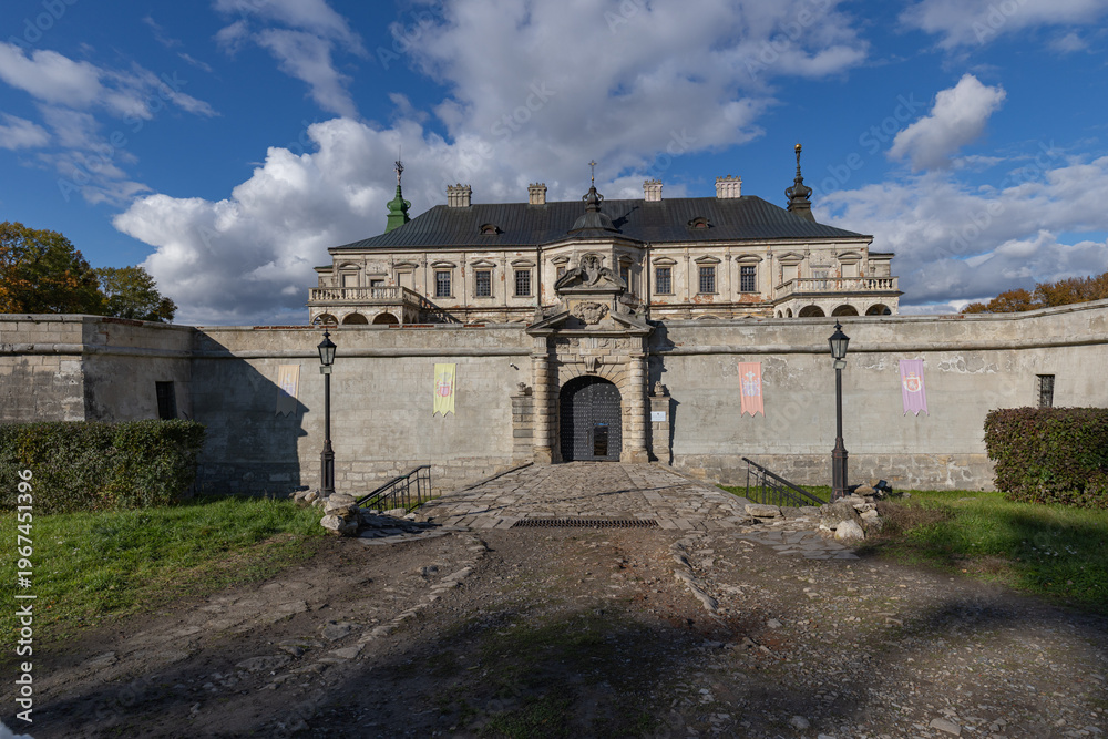 Fototapeta premium Renaissance Pidhirtsi Castle with dramatic storm clouds in Ukraine