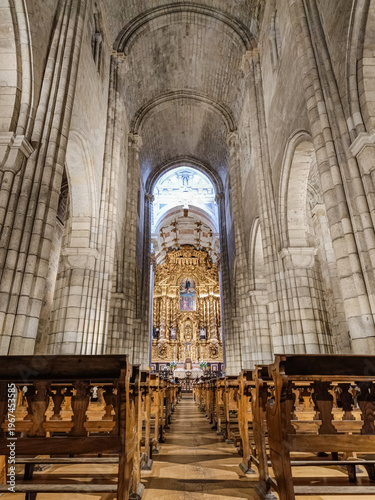 Perspective of the high Gothic nave with a gilded altarpiece in the chapel in the background, Porto PORTUGAL