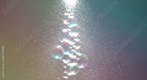 Abstract macro shot of a stream of colorful bubbles rising in water with rainbow-like light refractions