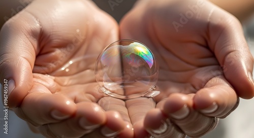 Close-up of Cupped Hands Protecting a Delicate Soap Bubble with Iridescent Reflections