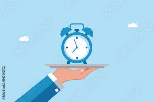 Time is served a blue alarm clock presented on a silver platter