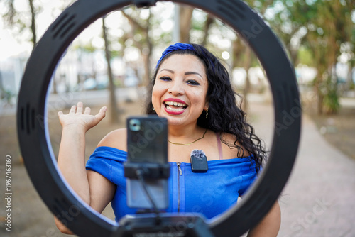 Latin woman influencer vlogging creating social media content