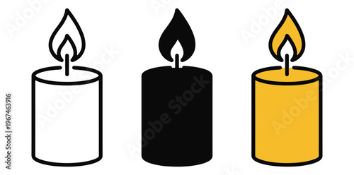 A set of three colorful candles in different hues with flames burning brightly silhouette