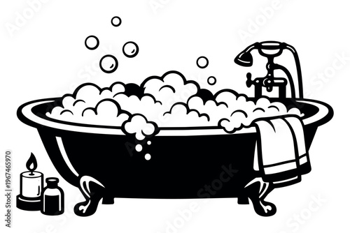 Clawfoot bathtub filling with foam and water, a towel draped on the side, and a lit candle for relaxation