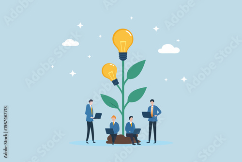 Growing ideas business people nurturing a plant with lightbulbs