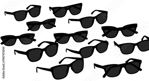 Collection of various black sunglasses scattered on a white background.