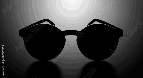 Silhouette of stylish sunglasses against a dramatic backlighting.
