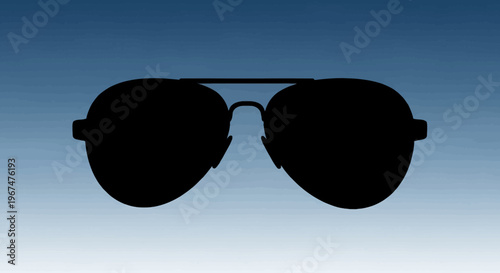 Classic Aviator Sunglasses Silhouette Against a Blue Sky.