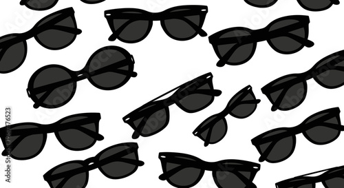 Stylish black sunglasses scattered on a clean white background.